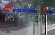 The entrance to a Foxconn factory in Shenzen. A Foxconn worker has fallen to his death in China, the company which assembles products for Apple said Thursday, following a series of fatalities that sparked concern about conditions at its plants