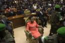 New parliamentary-elected interim President of the Central African Republic Samba-Panza sits surrounded by African Union peacekeeping soldiers prior to her swearing-in ceremony at the National Assembly in the capital Bangui