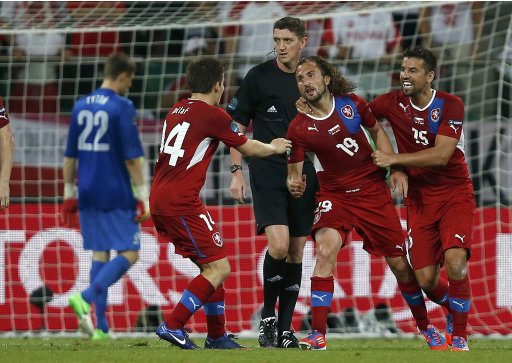 Czech Republic's Jiracek celebrates with his team mates Baros and Pilar after scoring a goal against Poland during their Group A Euro 2012 soccer match at the City stadium in Wroclaw