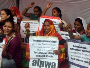Activists shout slogans against rape and acid attacks …