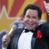 FILE - In this Feb. 14, 2012 file photo, Entertainer Wayne Newton performs during the 100th Anniversary celebration of Arizona's statehood, at the Capitol in Phoenix. The company that purchased the rights to convert Newton's home into "Graceland West" filed a lawsuit this week in Las Vegas against Newton, his wife and her 76-year-old mother that claims the family unreasonably delayed the project to ensure it never opens. (AP Photo/Matt York, File)