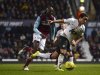 West Ham United's Alou Diarra challenges Manchester United's Rafael during their FA Cup third round soccer match in London