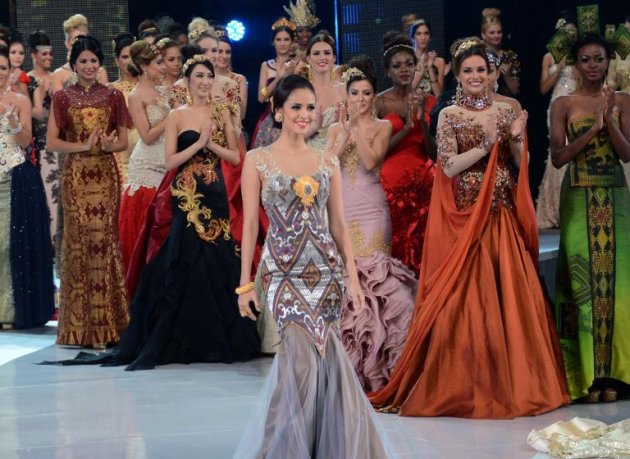 Miss Philippines Megan Young (C) is seen on the catwalk with other Miss World contestants in Nusa Dua, on the Indonesian island of Bali on September 24, 2013