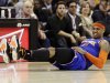 New York Knicks' Carmelo Anthony grimaces after falling in the second quarter of an NBA basketball game against the Cleveland Cavaliers, Monday, March 4, 2013, in Cleveland. (AP Photo/Tony Dejak)