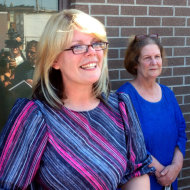 Kristine Bunch, left, with her mother Susan Hubbard, steps out of the Decatur County Sheriffs office after being released in Greensburg, Ind., Wednesday, Aug. 22, 2012, for the first time after 16 years in prison. Bunch was convicted of setting a 1995 fire that killed her 3-year-old son, but is free on bail as she awaits a new trial. (AP Photo/The Indianapolis Star, Charlie Nye) NO SALES