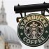 St Paul's Cathedral is pictured behind signage for a Starbucks coffee shop in London