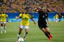 USA's Lindsey Horan (R) fights for the ball with Colombia's Carolina Arias during their women's Group G football match, at the Rio 2016 Olympic Games, in Arena Amazonia, Manaus, on August 9