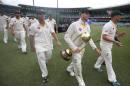 Australia's Steve Smith, second right, carries the Border/Gavaskar trophy after defeating India on the fifth day of their cricket test match in Sydney, Saturday, Jan. 10, 2015. The match is a draw and Australia won the series 2-0. (AP Photo/Rick Rycroft)