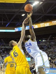 UCLA forward Shabazz Muhammad, right, is fouled by California forward David Kravish during the first half of their NCAA basketball game, Thursday, Jan. 3, 2013, in Los Angeles. (AP Photo/Mark J. Terrill)
