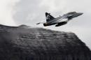 Swedish manufacturer Saab's Gripen F fighter flies on October 11, 2012 during a flight demonstration of the Swiss Air Force over Axalp in the Bernese Oberland