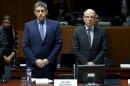 Belgian Interior Minister Jan Jambon and Justice Minister Koen Geens observe a minute of silence to victims of Tuesday's bombings during an extraordinary meeting of European Union interior and justice ministers in Brussels