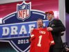 Eric Fisher, from Central Michigan, stands with NFL Commissioner Roger Goodell after being selected first overall by the Kansas City Chiefs in the first round of the NFL football draft, Thursday, April 25, 2013, at Radio City Music Hall in New York. (AP Photo/Jason DeCrow)