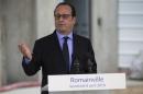 French President Francois Hollande delivers a speech after a visit at the construction site of a new housing development in Romainville,