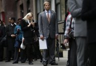 Job seekers stand in line to meet with prospective employers at a career fair in New York City, October 24, 2012. REUTERS/Mike Segar