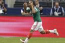 Mexico's Luis Montes celebrates after scoring against Ecuador in the first half of a friendly soccer match, Saturday, May 31, 2014, in Arlington, Texas. (AP Photo/Tony Gutierrez)