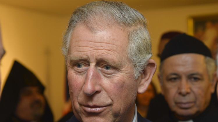 Britain&#39;s Prince Charles speaks to religious leaders during a visit to a Syriac Orthodox Church in west London
