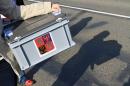 Two members of the Electoral Commission carry a portable ballot box as they go visit voters in the outskirts of Kyjov, southern Czech Republic on October 25, 2013