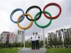 British tennis players Murray and Murray pose for photos with Olympic rings at Olympic Park in London