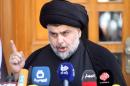 Moqtada al-Sadr speaks during news conference in Najaf