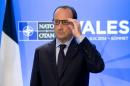 France's President Francois Hollande makes a statement to the press during the NATO summit at the Celtic Manor Hotel in Newport, South Wales, on September 4, 2014