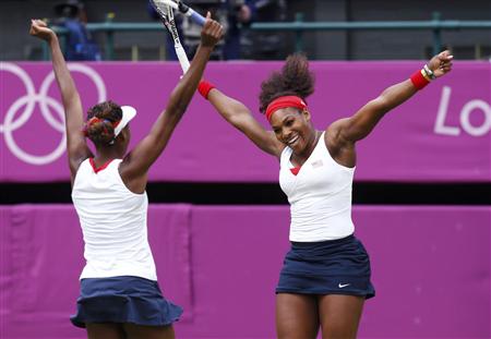 Sisters Serena Williams (R) and Venus Williams of the U.S. celebrate after defeating Czech Republic's Andrea Hlavackova and Lucie Hradecka in the women's doubles tennis gold medal match at the All England Lawn Tennis Club during the London 2012 Olympic Games August 5, 2012. REUTERS/Stefan Wermuth