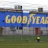Man walks past the Goodyear logo at the South Pacific Tyres facility in Somerton