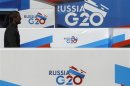 Banners of the G20 Summit hang on an embankment near the Neva river in St. Petersburg