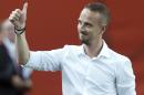 England coach Mark Sampson salutes the crowd as he walks onto the pitch for the team's match against Colombia in a Women's World Cup soccer match Wednesday, June 17, 2015, in Montreal. (Ryan Remiorz/The Canadian Press via AP)