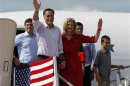 Republican presidential candidate and former Massachusetts Governor Romney, his wife Ann and other family members wave from the steps of their new campaign plane in Lakeland
