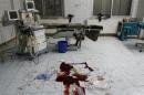 Blood is seen on a hospital floor in what activists say was shelling from forces loyal to President Bashar Al-Assad in Raqqa, eastern Syria