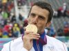France's Tony Estanguet kisses his gold medal during the victory ceremony for the men's canoe single (C1) event at Lee Valley White Water Centre during the London 2012 Olympic Games
