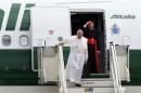 Pope Francis and Cardinal Bertone step off a plane after returning from their trip to Brazil at Ciampino airport, south of Rome