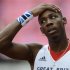 Britain's Phillips Idowu reacts after jumping in his men's triple jump qualification at the London 2012 Olympic Games at the Olympic Stadium
