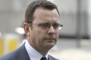 File photograph shows former News of the World editor Andy Coulson arriving to hear charges of phone hacking at Westminster Magistrates Court in London