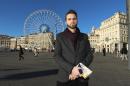 In this Wednesday, February 2, 2016 Imam Ludovic-Mohamed Zahed, poses on the Old-Port, in Marseille, southern France. A gay imam from Algeria is working with an LGBT association in Marseille to counsel and protect young gay Muslims who make their way to the ancient port city. The Le Refuge group says it has helped 26 gays find shelter and start a new life in Marseille last year. Some eventually go back to their families. (AP Photo/Claude Paris)