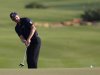 Donald of England hits onto the 18th green during the fourth and final round of the DP World Tour Championship at Jumeirah Golf Estates in Dubai