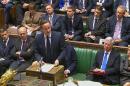 British Prime Minister David Cameron talks to lawmakers inside the House of Commons in London during a debate on launching airstrikes against Islamic State extremists inside Syria, Wednesday, Dec. 2, 2015. The parliamentary vote is expected Wednesday evening. (Parliamentary Recording Unit via AP Video) TV OUT - NO ARCHIVE