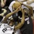 San Antonio Spurs' Kawhi Leonard (2) and Miami Heat's LeBron James (6) battle for a rebound during the first half at Game 4 of the NBA Finals basketball series, Thursday, June 13, 2013, in San Antonio. (AP Photo/David J. Phillip)