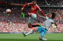 Newcastle United's Fabricio Coloccini (R) vies with Manchester United's Chris Smalling during the English Premier League football match in Manchester, England, on August 22, 2015