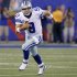 Cowboys quarterback Tony Romo runs with the ball against the New York Giants during their NFL football game in East Rutherford