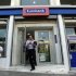 A man comes out of an Eurobank branch in central Athens