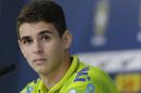 Brazil's Oscar looks on during a news conference after a training session at the Granja Comary training center in Teresopolis, Brazil, Saturday, June 14, 2014. Brazil plays in group A at the 2014 soccer World Cup. (AP Photo/Andre Penner)