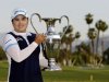 Inbee Park, of South Korea, holds up the trophy after winning the LPGA Kraft Nabisco Championship golf tournament in Rancho Mirage, Calif., Sunday, April 7, 2013. (AP Photo/Chris Carlson)