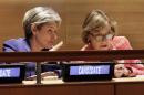 U.N. Secretary General candidates Irina Bokova, left, Director-General of UNESCO, and former Croatian Foreign Minister Vesna Pusic, listen to proceedings in the United Nations Trusteeship Council Chamber, Tuesday, April 12, 2016. For the first time in the 70-year history of the United Nations, all the member states will get a chance to question the candidates for Secretary-General, in a move to make the usually secret selection process for the world's top diplomatic post more transparent. (AP Photo/Richard Drew)
