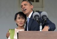 US President Barack Obama hugs Myanmar opposition leader Aung San Suu Kyi at her residence in Yangon. Obama urged Myanmar Monday to hasten its "remarkable" reforms on a historic visit during which he was feted by huge crowds