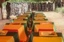 Coffins of Malian army officers killed in an attack are displayed on July 21, 2016 in Segou during a funeral ceremony