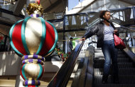 <p>               A woman rides the escalator past a giant holiday ornament at the CambridgeSide Galleria mall in Cambridge, Mass., Monday, Dec. 24, 2012. Although fresh data on the holiday shopping season is expected in coming days, early figures point to a ho-hum season for retailers despite last-ditch efforts to lure shoppers over the final weekend before Christmas. And with concerns about the economy and the looming “fiscal cliff” weighing on the minds of already cautious shoppers, analyst say stores will need to offer “once in a lifetime” blowouts to clear out inventory.  (AP Photo/Michael Dwyer)