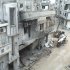 Damaged buildings are seen along a street in the al-Khalidiya neighbourhood of Homs