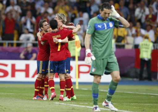 Spain's Mata celebrates with team mates after he scored the winning goal against Italy's Buffon during their Euro 2012 final soccer match at the Olympic Stadium in Kiev