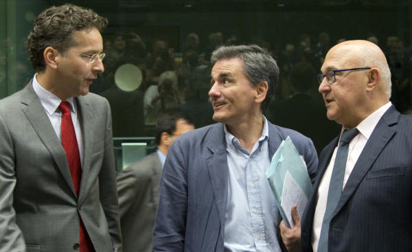 The Latest: Hollande: Greece has to make 'serious proposals'